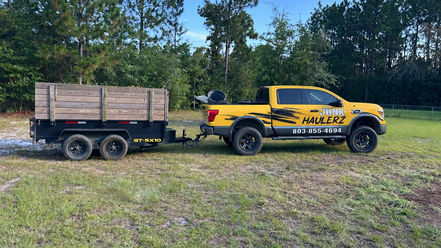 Junk Haulerz truck towing its 5x10 dump trailer