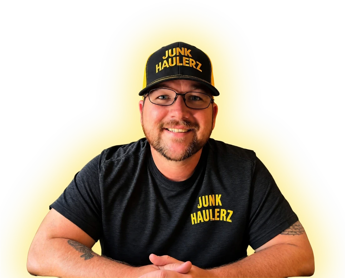 Pat Boatwright, owner of Junk Haulerz, in a Junk Haulerz cap and T-shirt