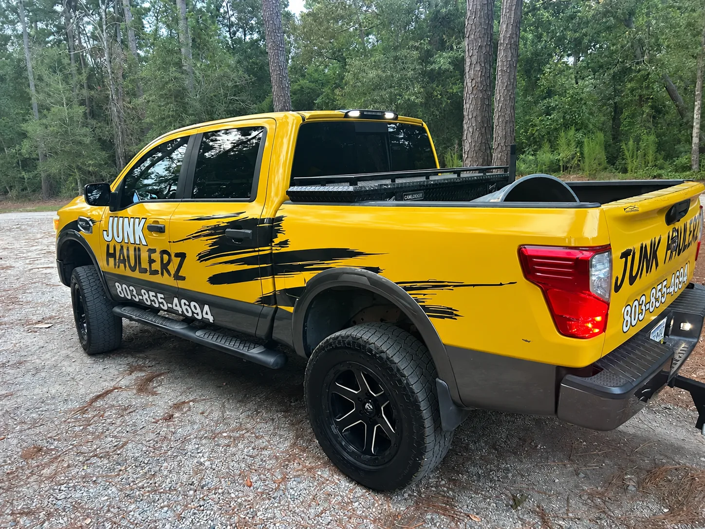 Back of the Junk Haulerz truck with the company name and number