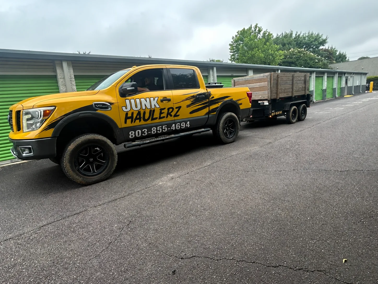 Junk Haulerz truck and trailer at a storage facility