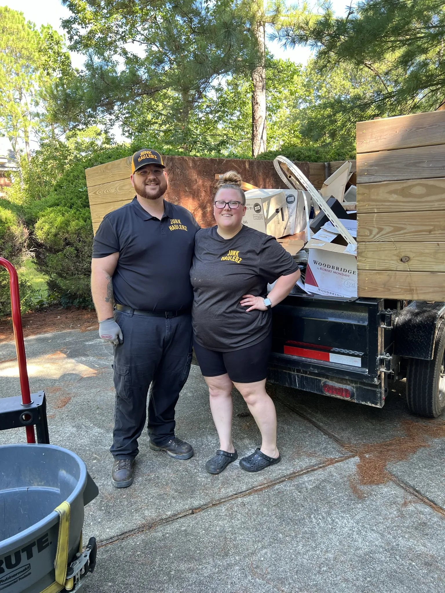 Pat Boatwright and a crew member standing by the loaded trailer